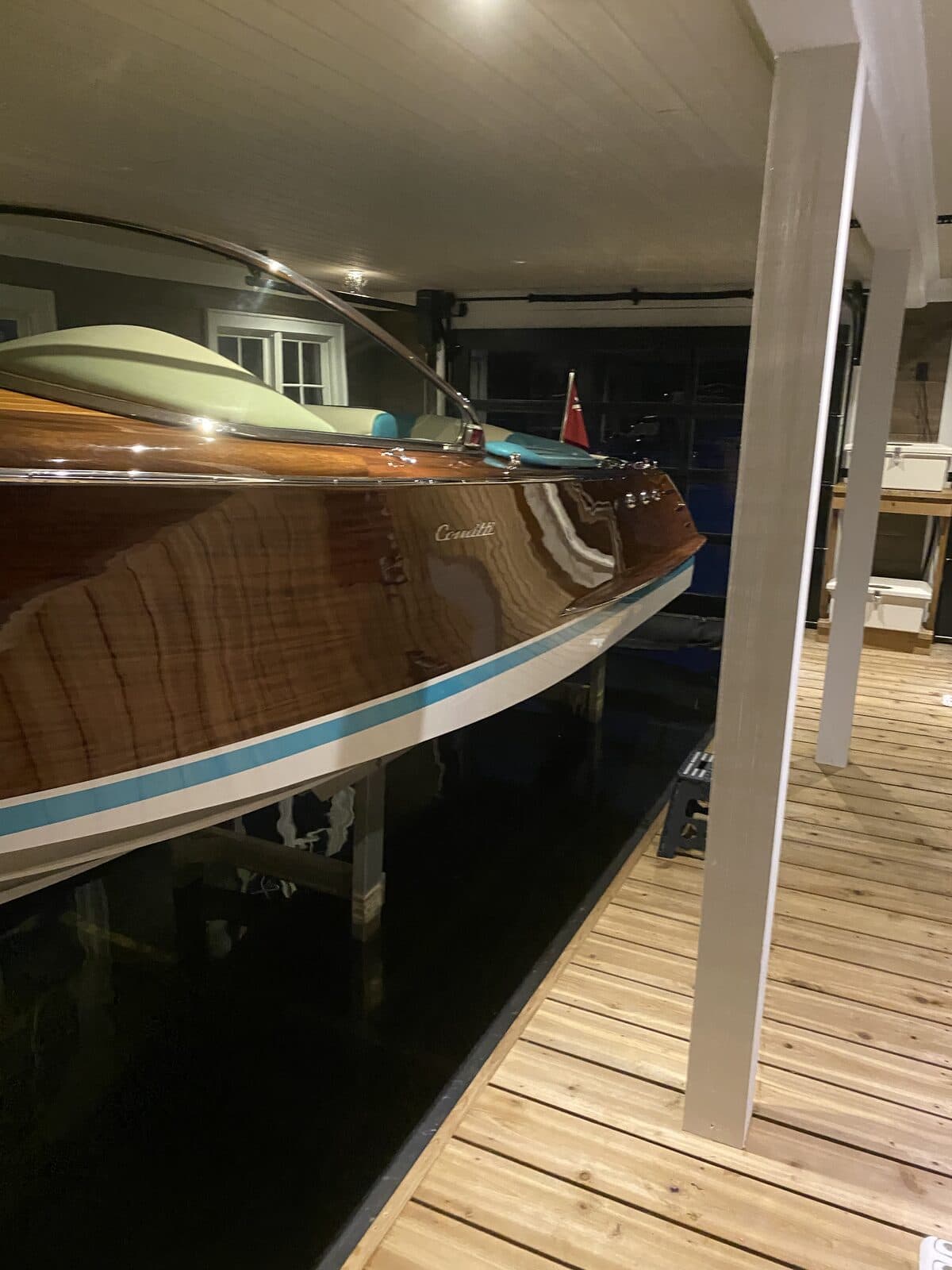 Classic mahogany boat moored in a Muskoka boathouse